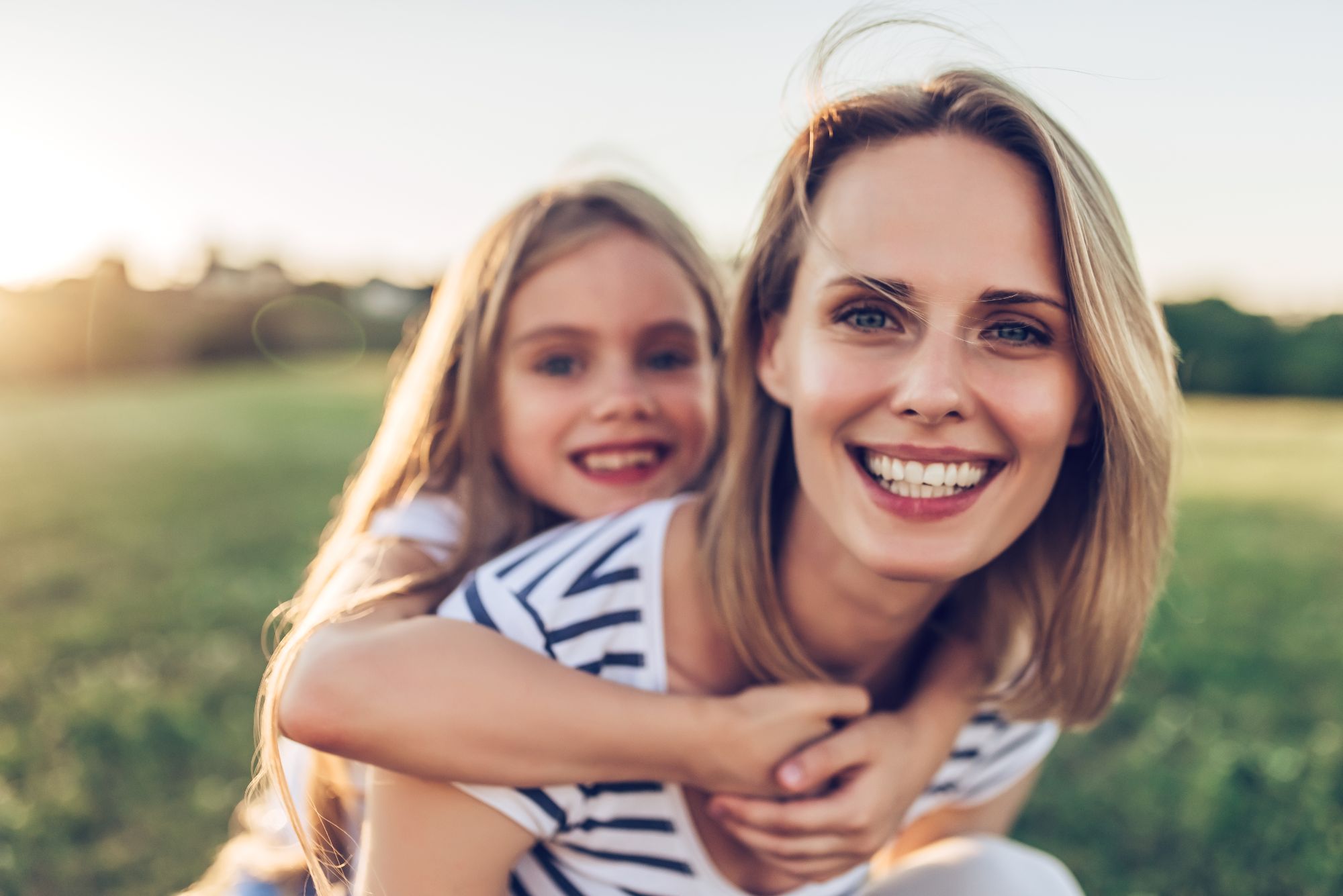 Mother and daughter smiling outdoors representing family-friendly braces care in Franklin TN
